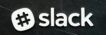 Close-up of Slack logo with hashtag symbol on a dark textured background, emphasizing digital communication.